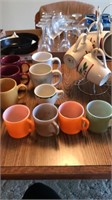 Collection of coffee mugs with stand