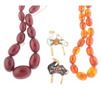 A Pair of Amber Necklaces and Cloisonne Charms