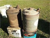Vintage gas cans and cases of motor oil