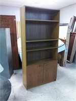 Shelving unit with shelves and doors for storage