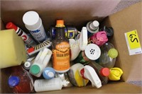 Box of cleaning supplies and lubricants