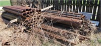 Assorted large pile of metal pipe