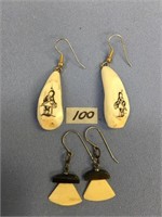 A pair of baleen and ivory ulu earrings and a pair