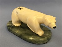 An outstanding 6" carved ivory polar bear with ins