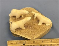 Ivory scene of two hungry polar bears being introd