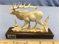 3.5" antler carving of a bull elk mounted on walnu