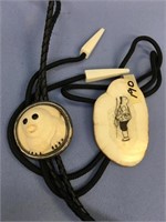 2 Scrimshawed ivory bolo ties - one is scrimmed by