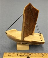 3.75" fossilized ivory boat by Arnie Iyakitan