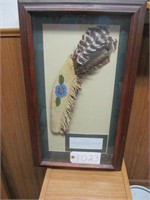 Ceremonial feather fan in shadowbox