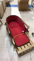 LL Bean child's Pull snow sled with the cushion
