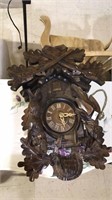 Black forest style cuckoo clock with hunting