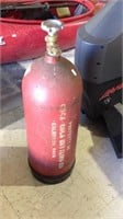 One vintage metal carbon dioxide tank with