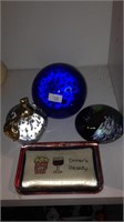 Set of four glass paperweights