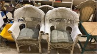 Pair of white wicker chairs with seat cushions 26