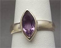 Sterling silver ring with light purple stone.