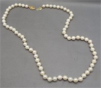 Genuine pearl necklace with 14K yellow gold