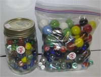 Large group of various sizes of marbles including