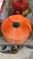 Large roll of nylon tiedown strap bright orange