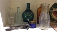 Group lot of seven glass collector bottles
