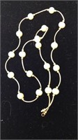 One marked 14 K gold and pearl necklace