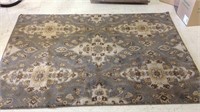 One medium size room rug with a silver gray and