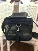 Large black zippered mesh pet carrier with leash
