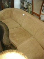 Rounded tan fabric couch