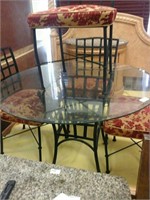 Metal table with round glass top and 4 metal