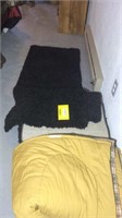 Pair of black shag runner rugs and sleeping bag
