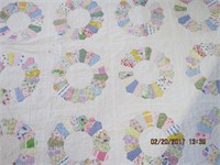 Hand quilted 54 X 86" quilt (small tear see