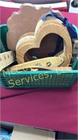 Wooden craft items and plastic basket