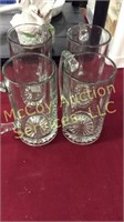 Four large etched glass beer mugs