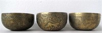 Three antique Asian alms bowls 11cms dia