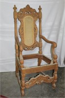 Ornately Carved Arm Chair with Rattan