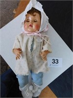 Sleepy eyed baby doll, 21" tall, with movable
