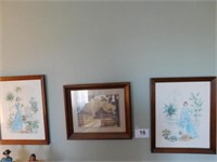 Framed pictures on wall: ladies dressed in blue