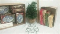 Christmas decor includes ornaments small tree and