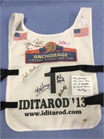 Iditarod bib signed by assorted mushers from 2013