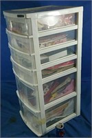 6 drawer plastic organizer full of craft supplies