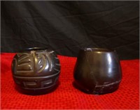 Set of two black pottery pieces