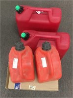 Two 5 gallon spill proof gas cans, two 5 liter gas