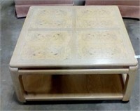 Square coffee table on wheels with lower shelf
