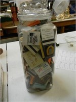 VINTAGE TALL JAR HOLDING OLD MATCHBOOKS FROM VEGAS