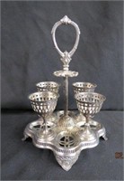 4 egg cups in silver plate rack