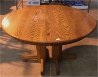 Contemporary round oak table