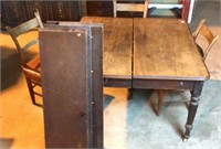 Antique farm table with three chairs