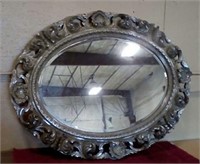 Large oval wall mirror, antiqued finish