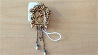 Vintage cuckoo clock pin with moving cords