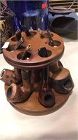 Seven vintage tobacco smoking pipes with stand