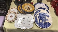 11 decorative plates some have wall hangers on